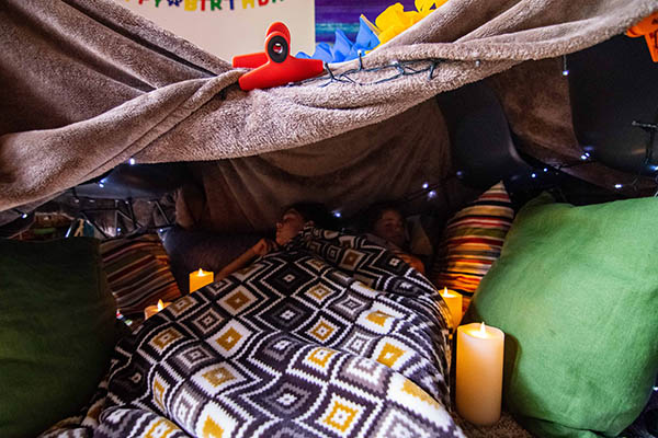 Photo of kids in a homemade tent